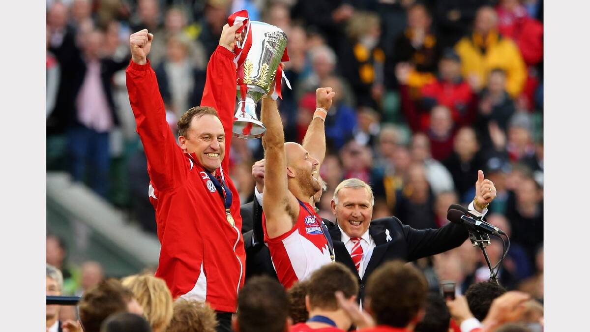 Longmire would go on to coach the Sydney Swans to a premiership in 2012. He is pictured here with Swans' captain Jarrad McVeigh. Picture: GETTY IMAGES