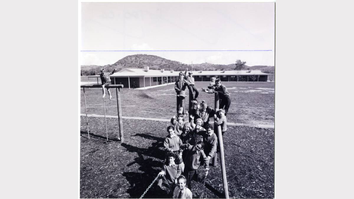 Children posing on play equipment in front of the fledgling Victory Primary School (now Victory Lutheran College), 1992. Picture: ALBURYCITY COLLECTION