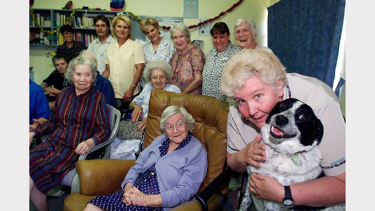 Albury and District Private Nursing Home is finally fully accredited. Spud the dog with nursing director Bev Bragg and other residents. Picture: SIMON DALLINGER