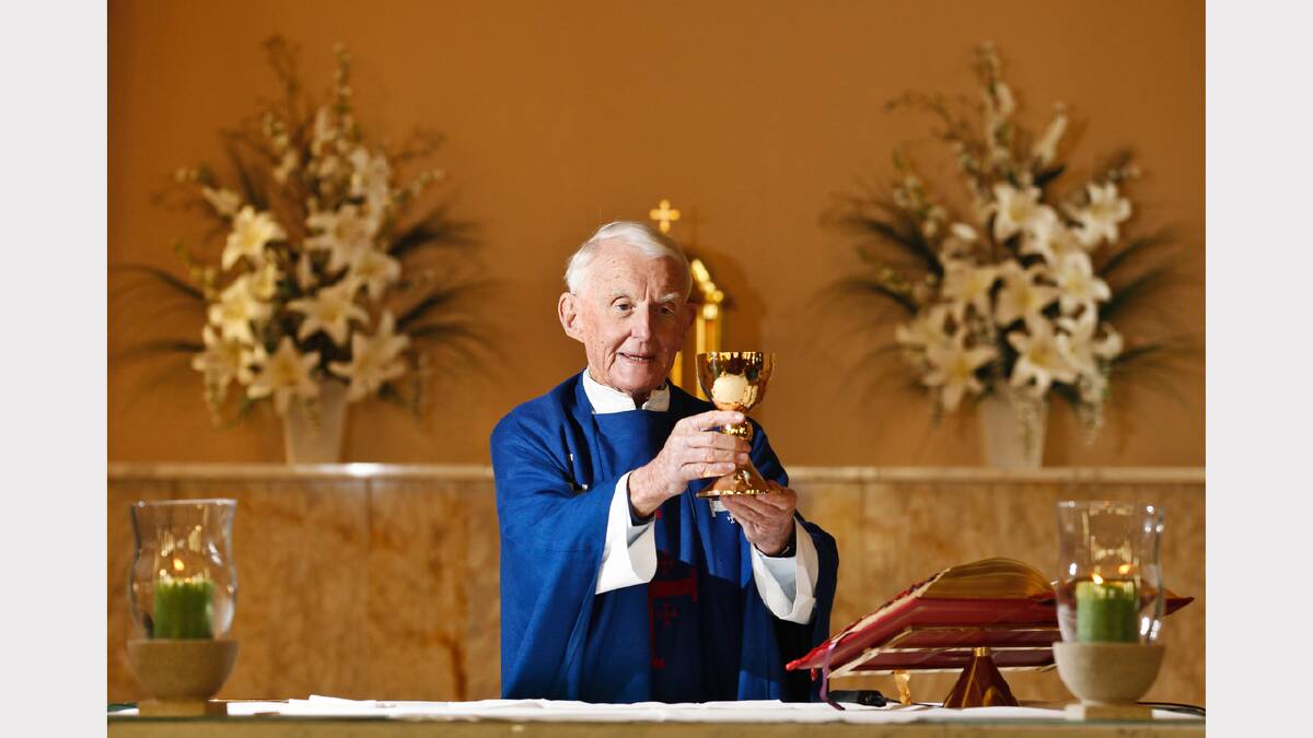 Father Kevin hold the chalice his family gave him when he was ordained.