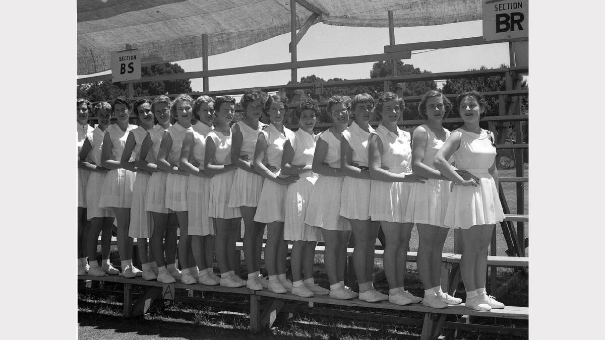 Usherettes helped spectators see an Albury exhibition by Australia's 1955 Davis Cup team.