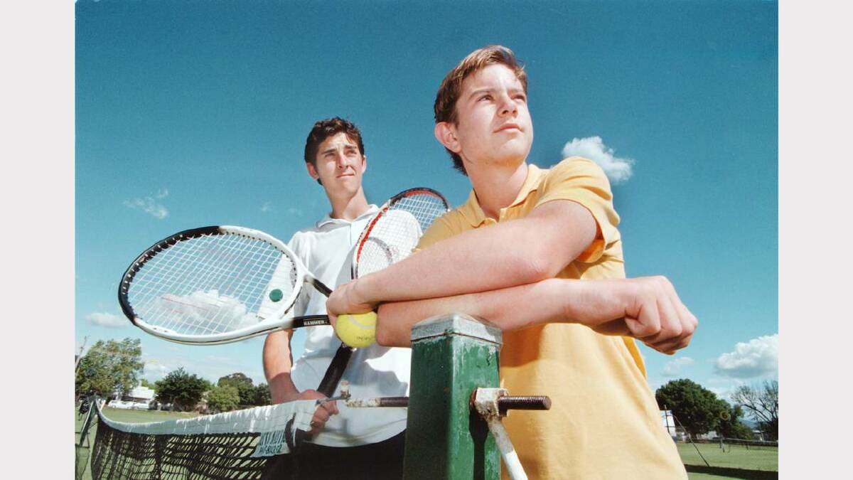Patrick Landy, 16, of Ettamogah and Ben Esler, 14, of Albury, prepare for the Westpac Shield tournament at the Albury grasscourts. Picture: PETER BATSON