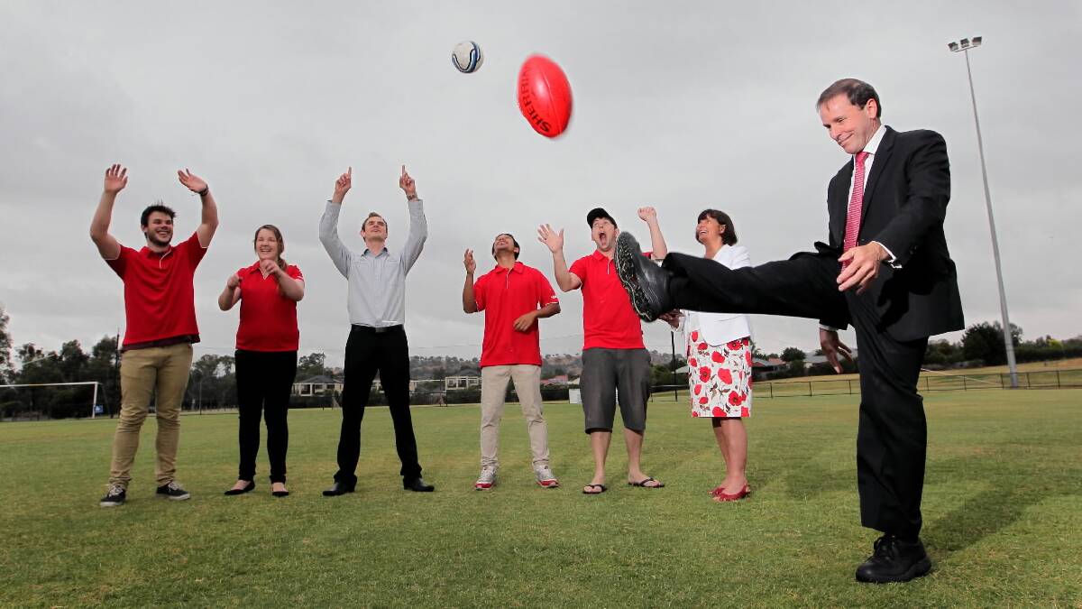 Rodney Wangman and La Trobe University head of campus Guinever Threlkeld celebrate the choice of Wodonga for the University Games, alongside  Chris Hughes, Rebekah O’Keefe, Ben King, Rocky Hellway and Justin James at the La Trobe soccer ground yesterday. Picture: DAVID THORPE