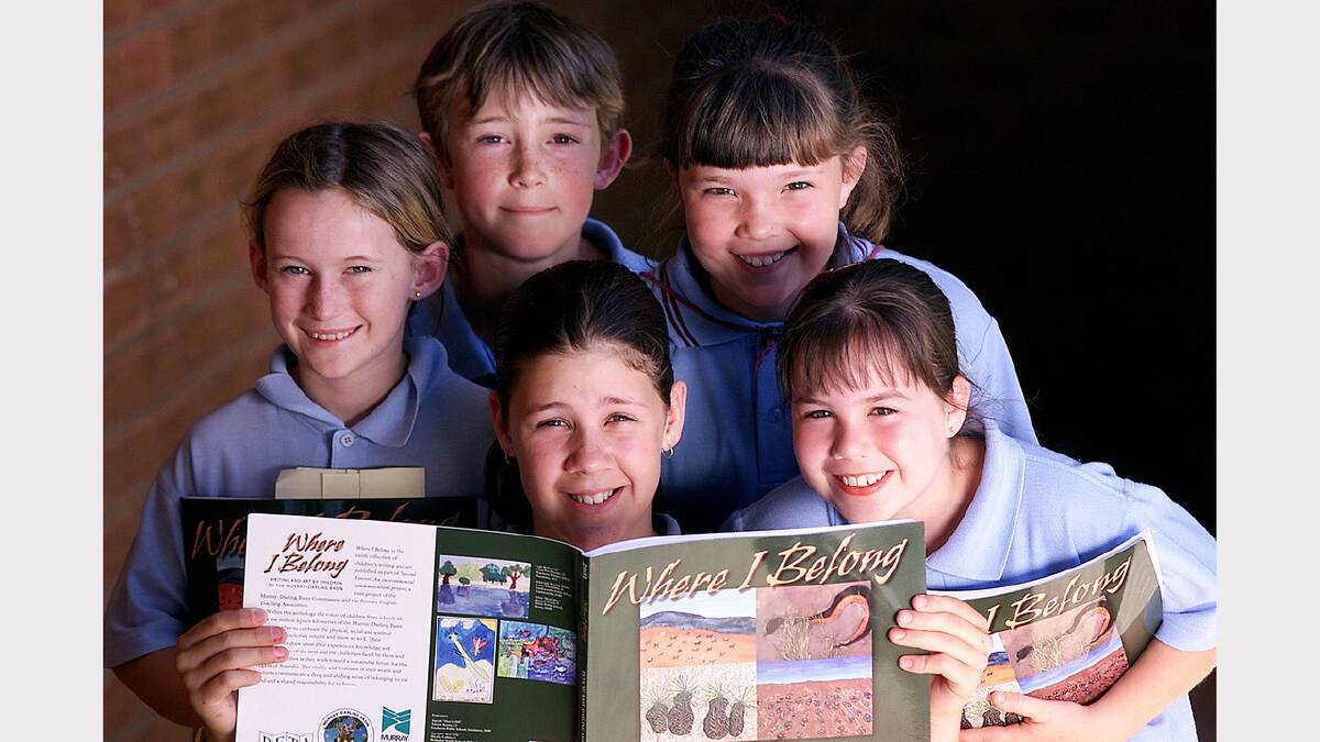 Students from Wodonga Primary School with the book in which they had work published 'Where I Belong'. Lisa Tippett, Jared Lockley, Hayley De Kruiff, Emily Taylor and Shenae Suridge. Picture: SIMON DALLINGER