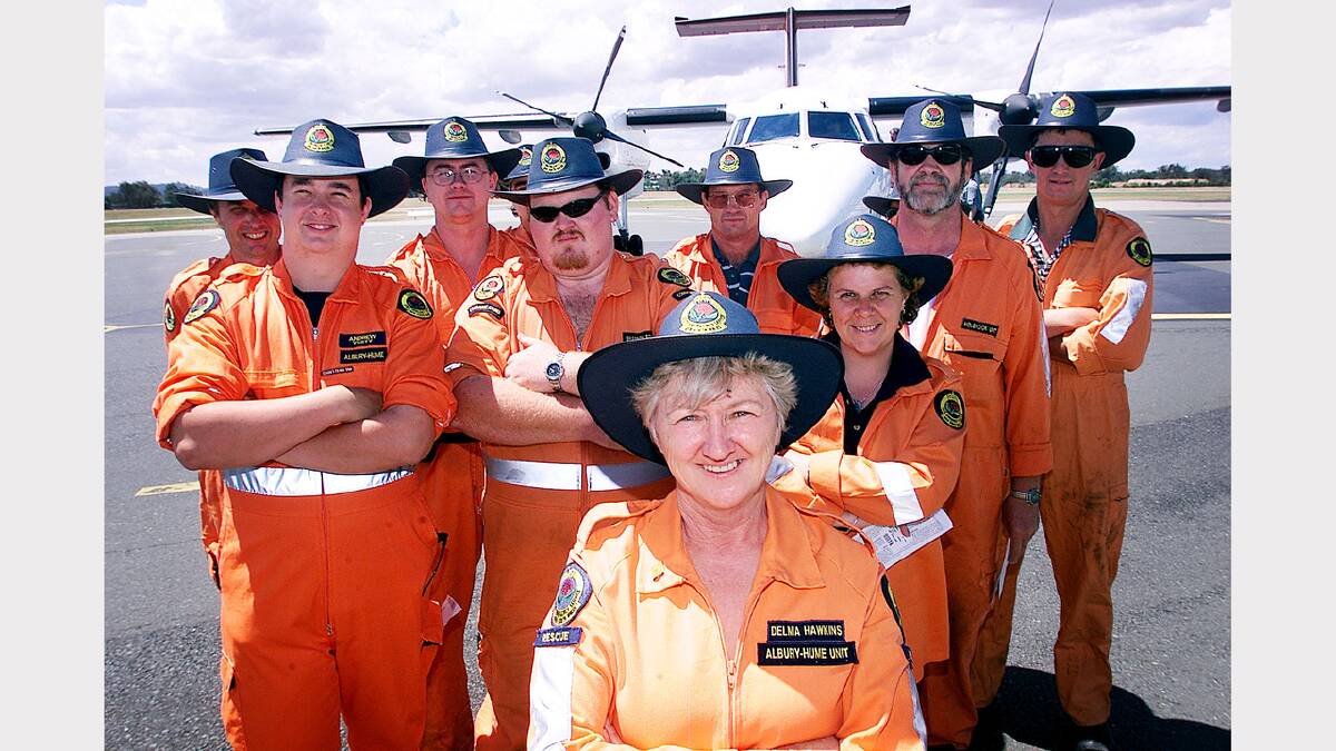 Up to 14 SES volunteers are travelling to Sydney to help in the clean-up after the storms. Delma Hawkins (front) is from the Albury-Hume SES Unit with other members from Albury, Holbrook and Culcairn, Andrew Vesty, Sally Conlan, Shane Newcombe, Rod Peters, Lester Price, Shannon Britton, Graham Hallam , Harry Lawrence, Lee Churches and Matt Lawrence. Picture: SIMON DALLINGER