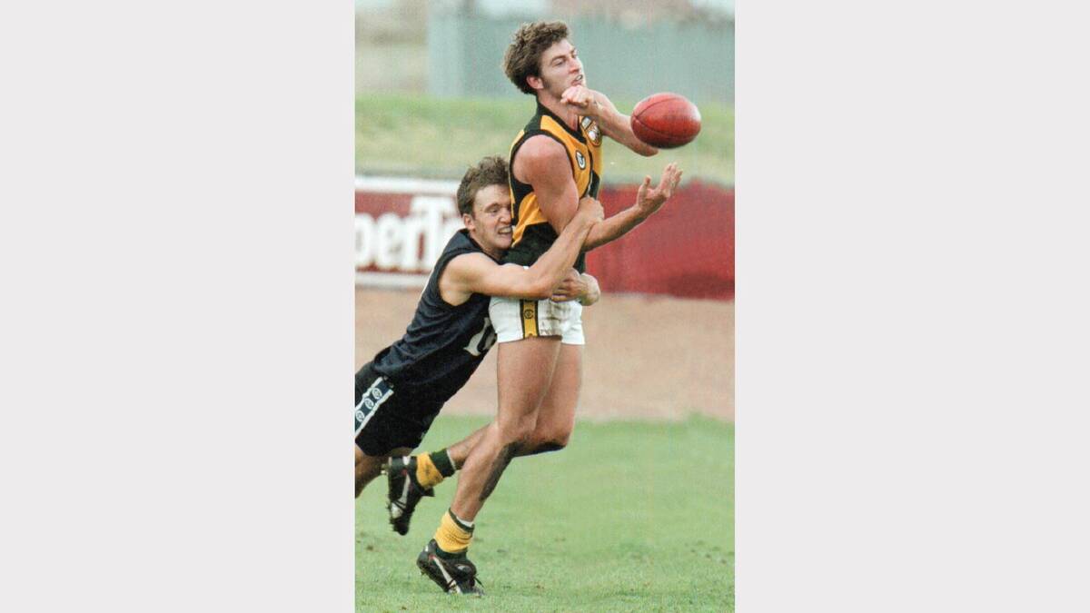 Brett Kirk was a standout for North Albury in the Ovens & Murray Football League before being drafted to the Sydney Swans as a rookie. He is pictured here in 1998, playing against Lavington.
