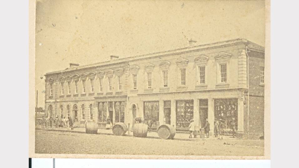 The Globe Hotel and adjoing wine cellars and shops in Kiewa Street, around 1870.