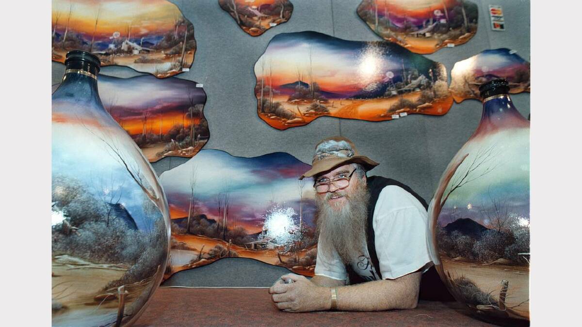 CraftAlive Show at the Albury Convention Centre. Rod Cameron, of Melbourne, is a member of the Australian Bush Painters group pictured with his artwork. Picture: CHRIS McCORMACK