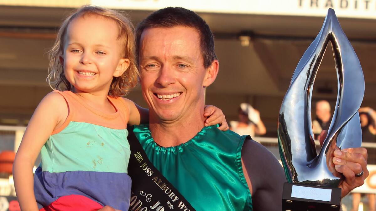 Shane Ezard, pictured last year with his daughter Jorga, is back to defend his title this weekend.