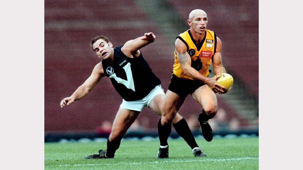 A triple Morris Medallist, John Brunner was one of the finest modern-day Ovens and Murray Football League players. He played a total of 186 matches for Yarrawonga and Benalla. He is pictured here playing for the O&M league against the Victorian Amateurs team in 1999.