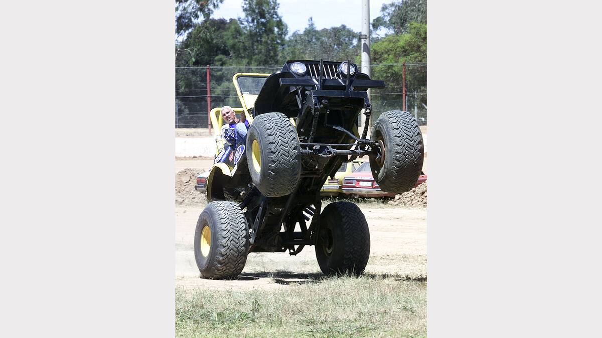 Ian Soanes pulls a wheelie in his Jeep monster truck as part of the show at Wangaratta Speedway. Picture: SIMON GROVES
