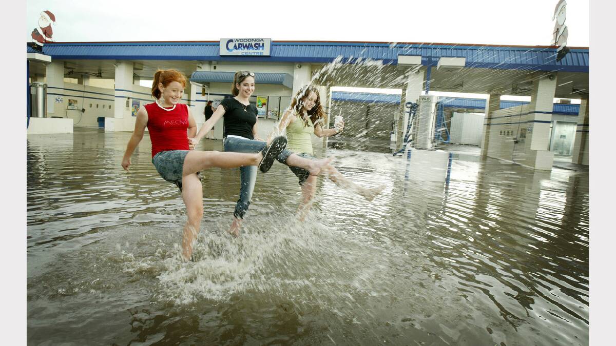 Wodonga was hit by a storm that caused flash flooding. Hayley Symons 11, Natalie Coall 17 and Tammy Dulhunty 16. Picture: SIMON DALLINGER