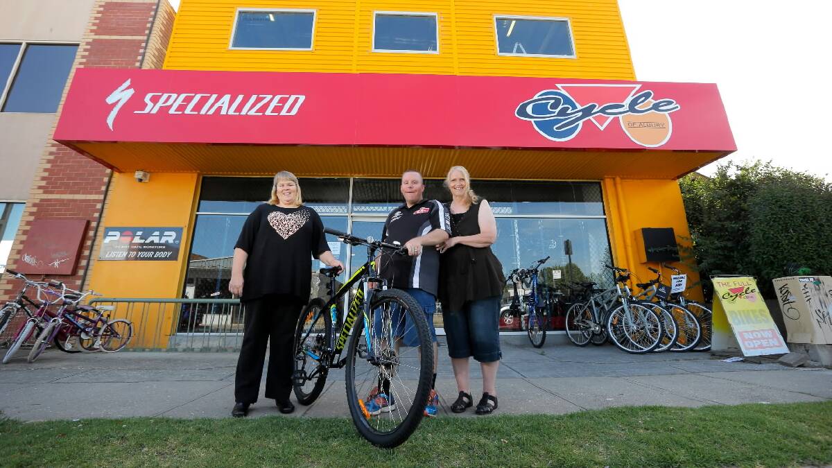 Susanne Walters, of Lavington, donated a new bike to John Morey, of Wodonga, after his was stolen. He is pictured picking up the bike with his mum Barbara Morey. Picture: TARA GOONAN