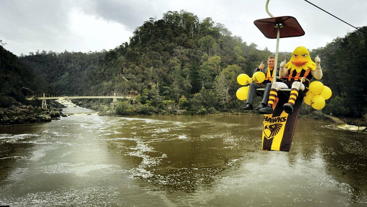 Deputy Mayor Jeremy Ball and Hawka take a ride across the Cataract Gorge in the lead-up to tomorrow's AFL game. Picture: Scott Gelston, The Examiner
