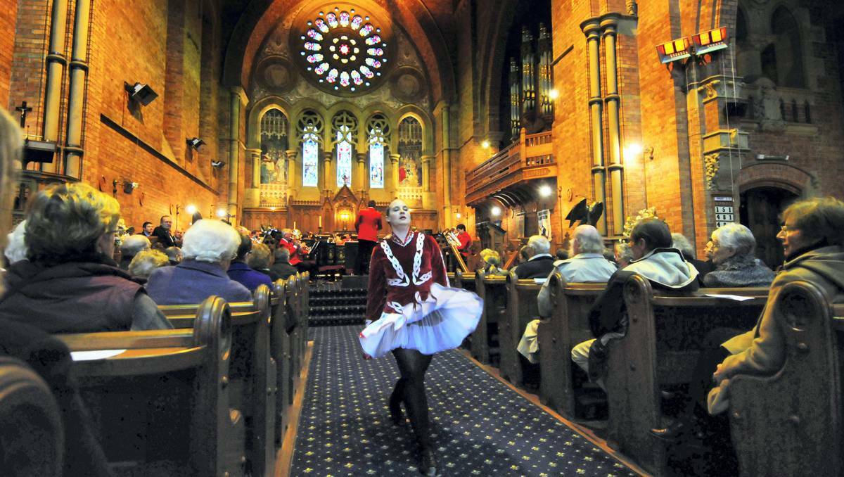 Kaitlin Roach keeps the crowd entertained at the City of Launceston RSL Band Brass and Pipes Spectacular as she dances down the aisle of the Holy Trinity Church. Picture: Phillip Biggs, The Examiner