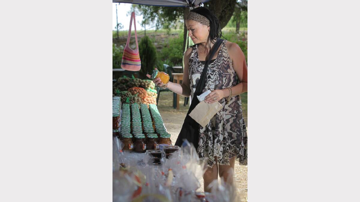 LA DOLCE VITA: Sandy Baldwin, of North Croydon, looks at Jenny's Homemade Pickles and Jams, made locally in Cheshunt, at La Cantina during the festival.