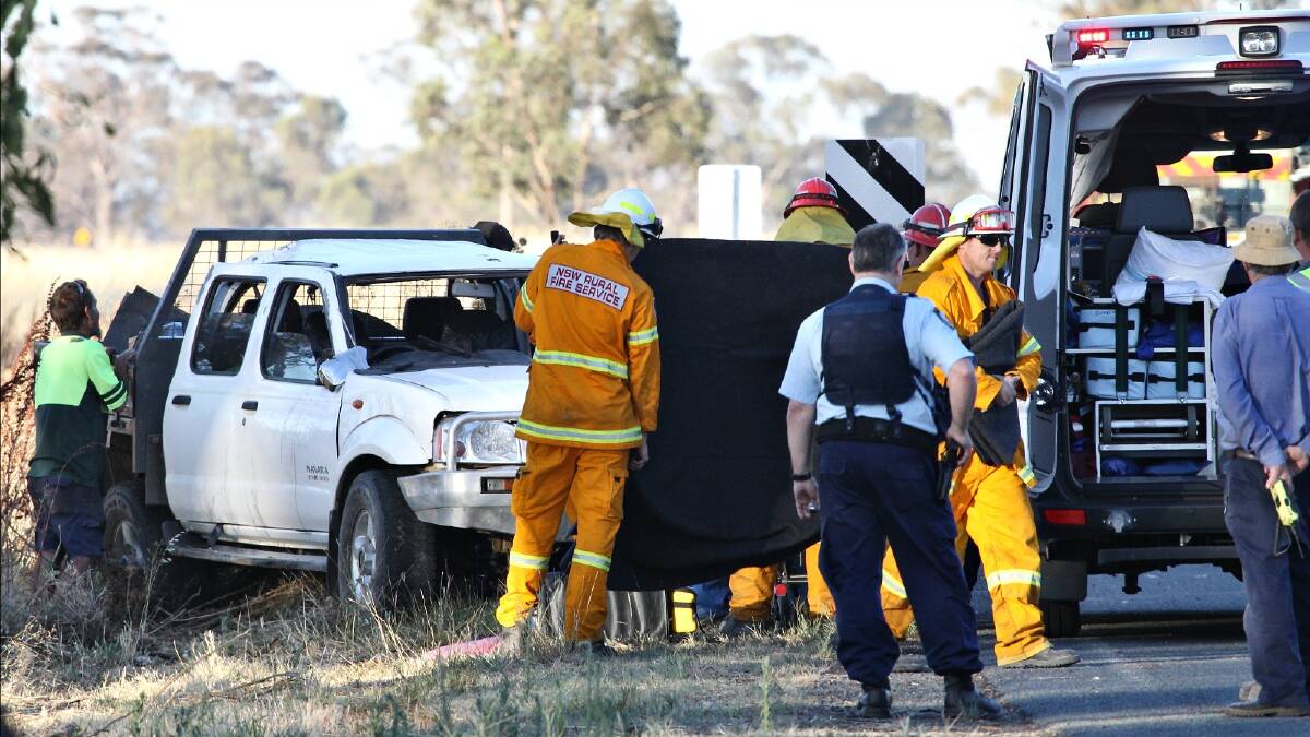 Emergency services help rescue a woman, 34, whose car crashed on the Hopefield Road at Balldale last night. Picture: BEN EYLES