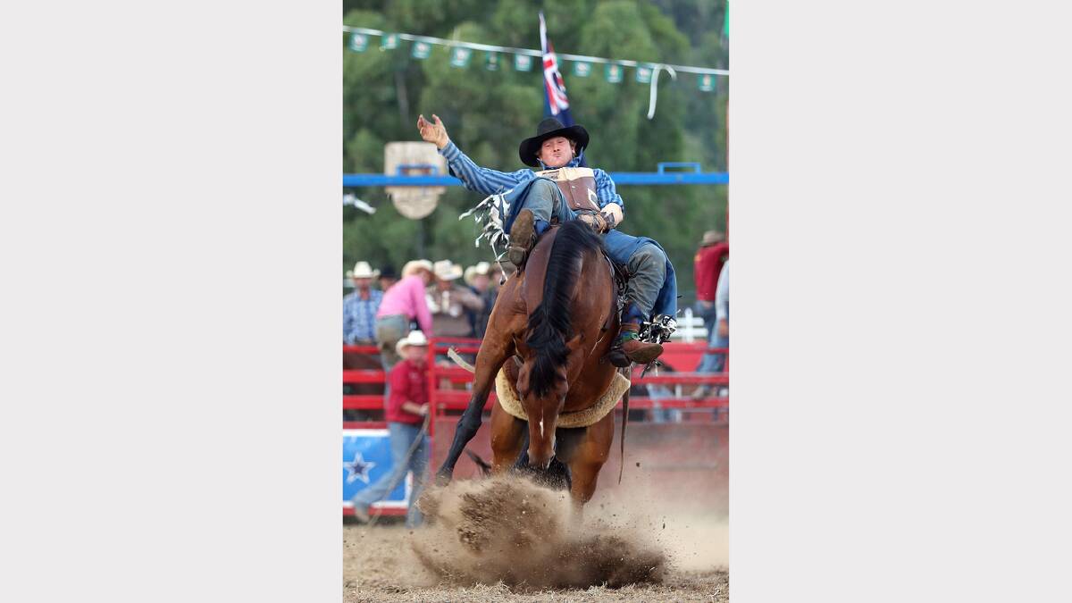 Gerard Oversby hangs on during the Bare Back Bronc Riding competition.