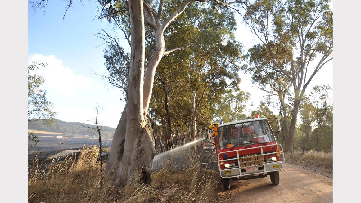 Firefighters mop up a fire on a property near Chiltern. There were fears it would spread into Mount Pilot National Park. Pictures: JOHN RUSSELL