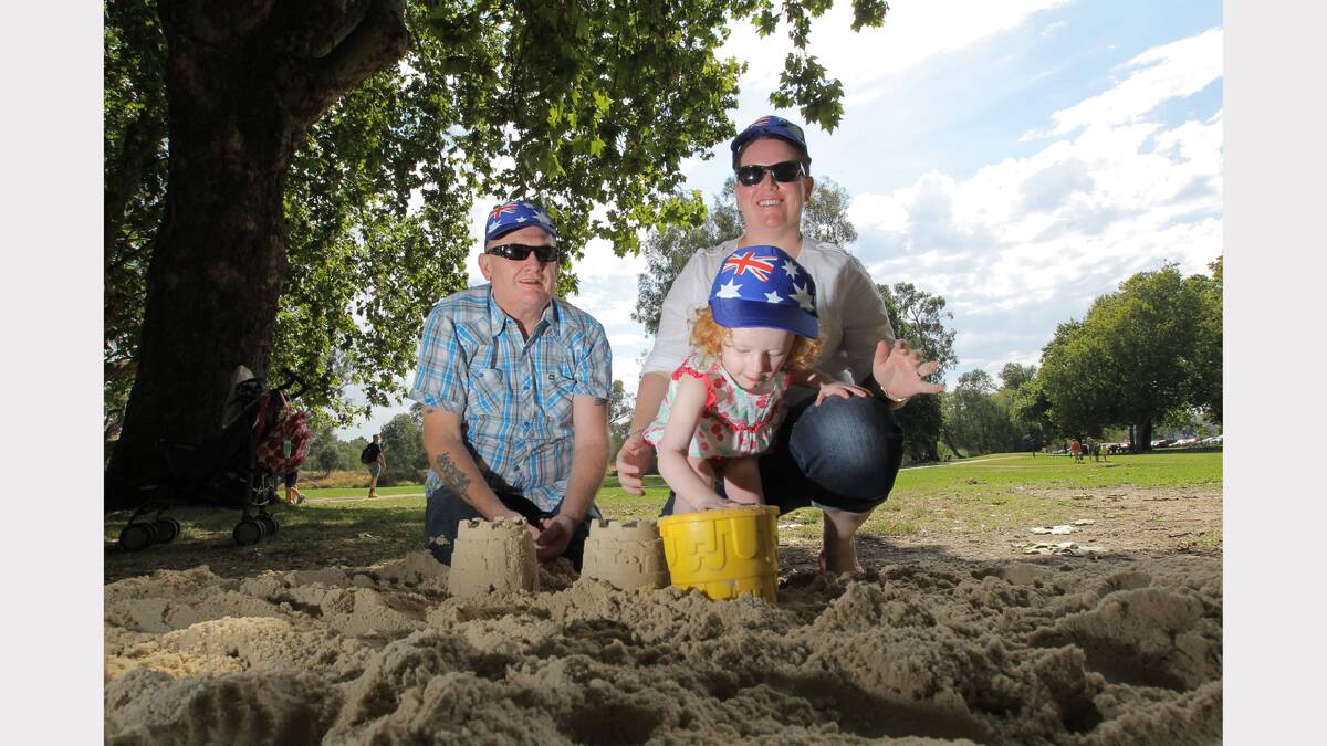 Noreuil Park, Australia Day Ceremony 2013, L-R: Don Dover, Alexandra Dover, 2, and Kelly Dover, of Wodonga, playing in the sand. PICTURE: Tara Goonan.