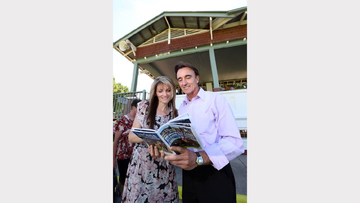 Lisa Carpenter from Wodonga and friend Paul Stone from Indigo Valley check out the form guide.