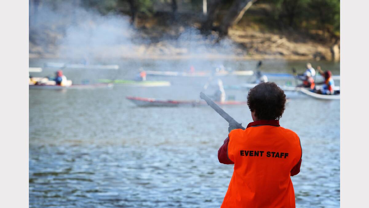 Starter Wendell Rizzoli launches the paddlers to a smoky start.
