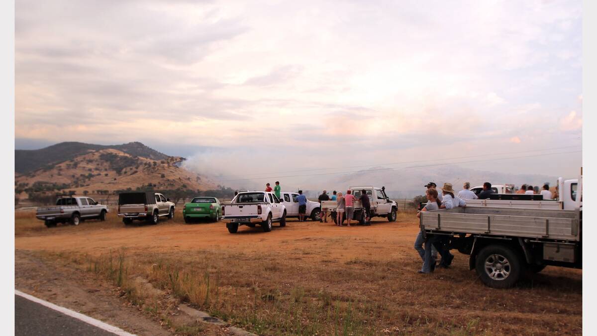 Spectators watched the fire on the hill. Photo: Peter Merkesteyn.