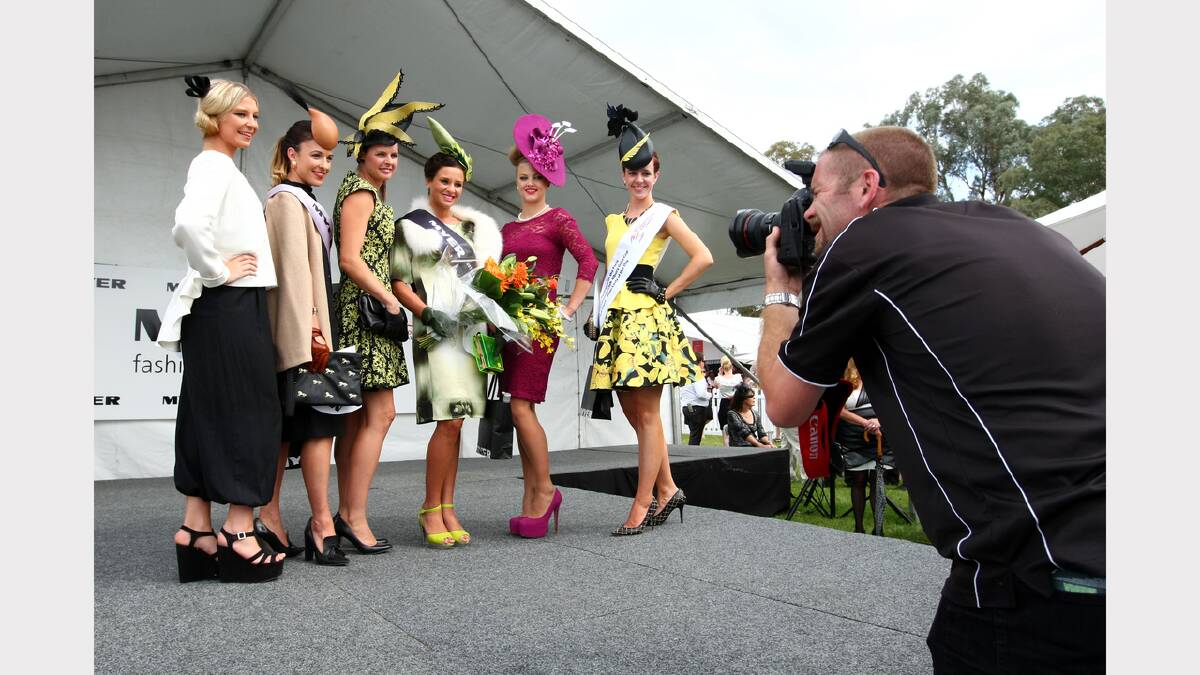 Photographer John Russell photographs the fashions on the field at the Albury Gold Cup.