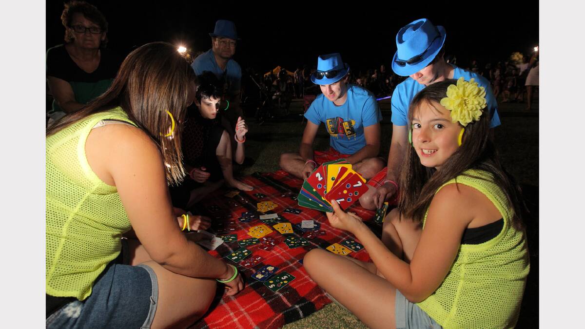 Hayley Mumberson, 10, of Wandong, playing cards with her family at Birallee Park. PICTURE: Tara Goonan.