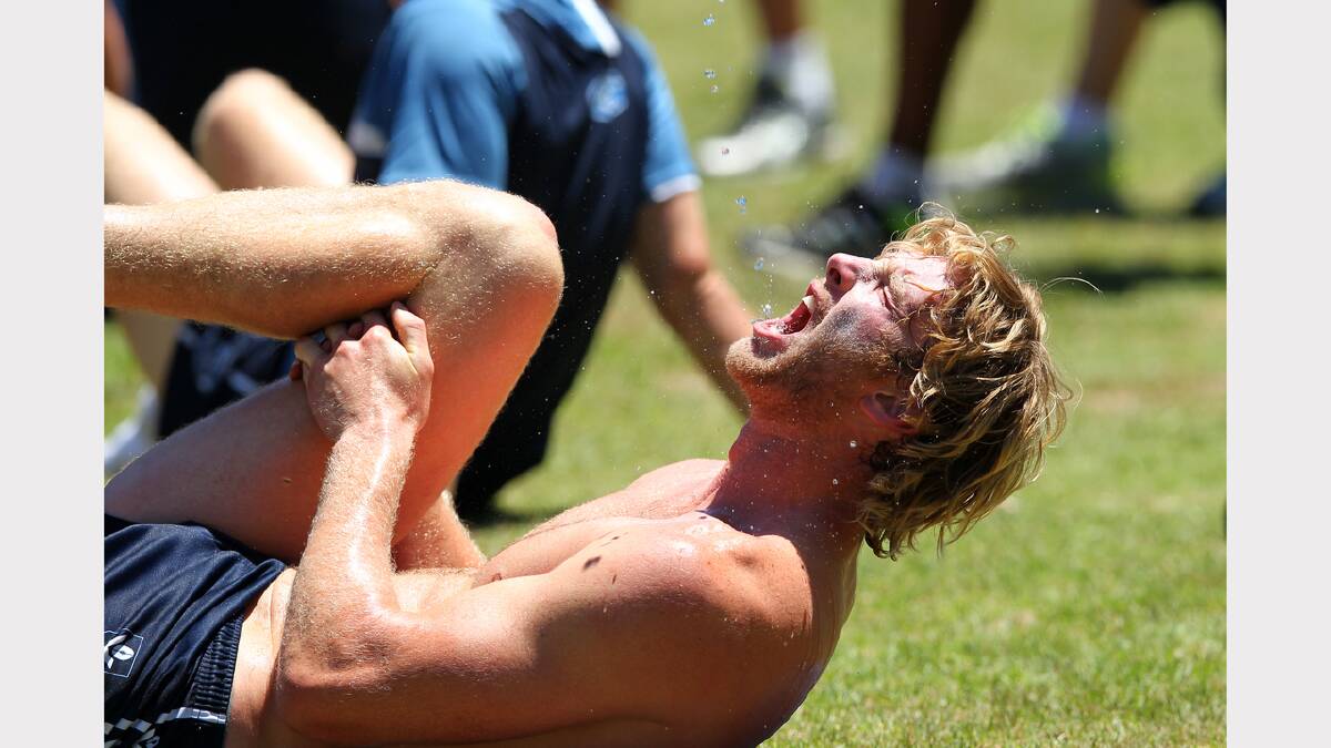 Geelong Football Club trains at the Mt Beauty football ground for the AFL pre-season. Dawson Simpson takes relief from the heat.