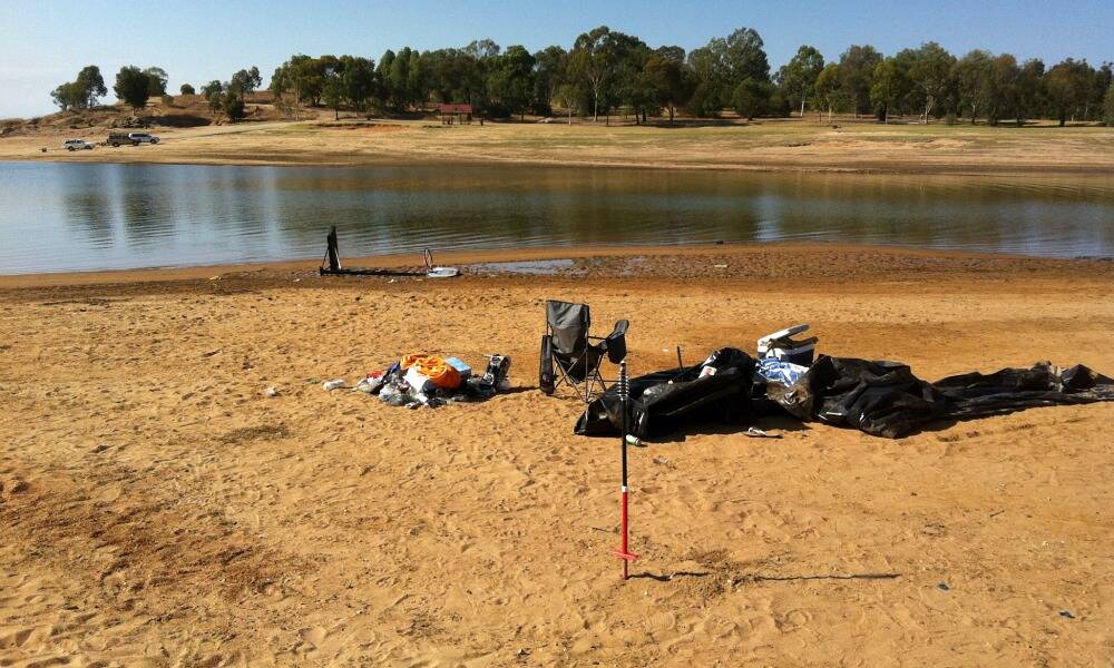  Inflatable boats, sheets of black plastic and other rubbish littered Kookaburra Point on Sunday. Picture: LACHLAN PINDER
