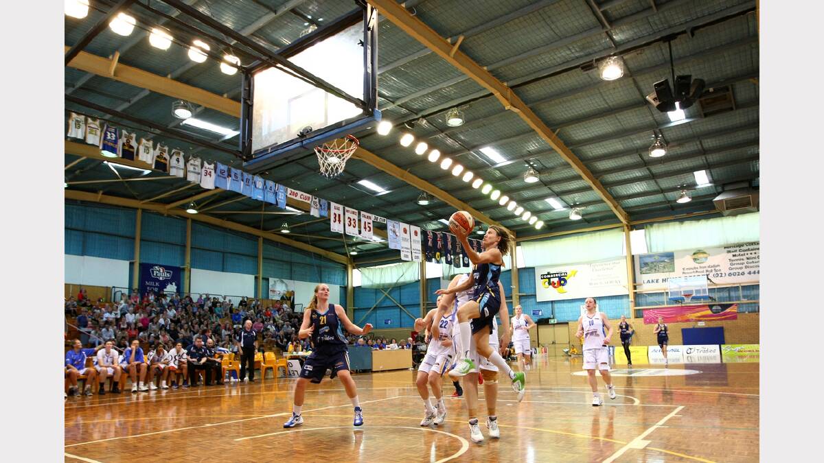 Former Lady Bandits player and current Canberra player, Jessica Bibby flies for the net during the WNBL match between Canberra Capitals and Bendigo Spirit at the Lauren Jackson Sports Centre. PICTURE: Matthew Smithwick.