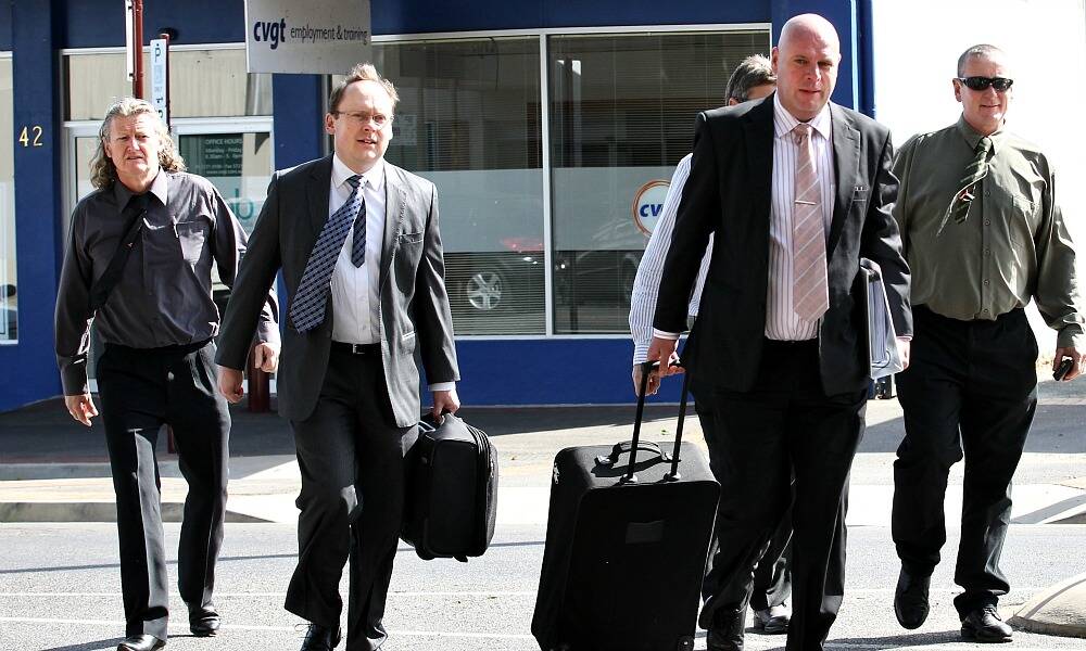 Tramps president Ronnie Harding, barrister Michael Seelig, solicitor John Suta and butcher Michael Oxenham head into the Supreme Court hearing in Wangaratta yesterday, in an effort to have gun licences returned.