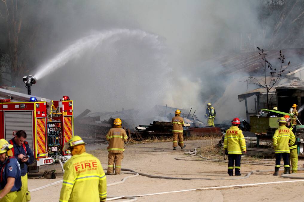 Fire crews battle the blaze at the Weatherall Masonry site on the Lincoln Causeway. Picture: BEN EYLES.
