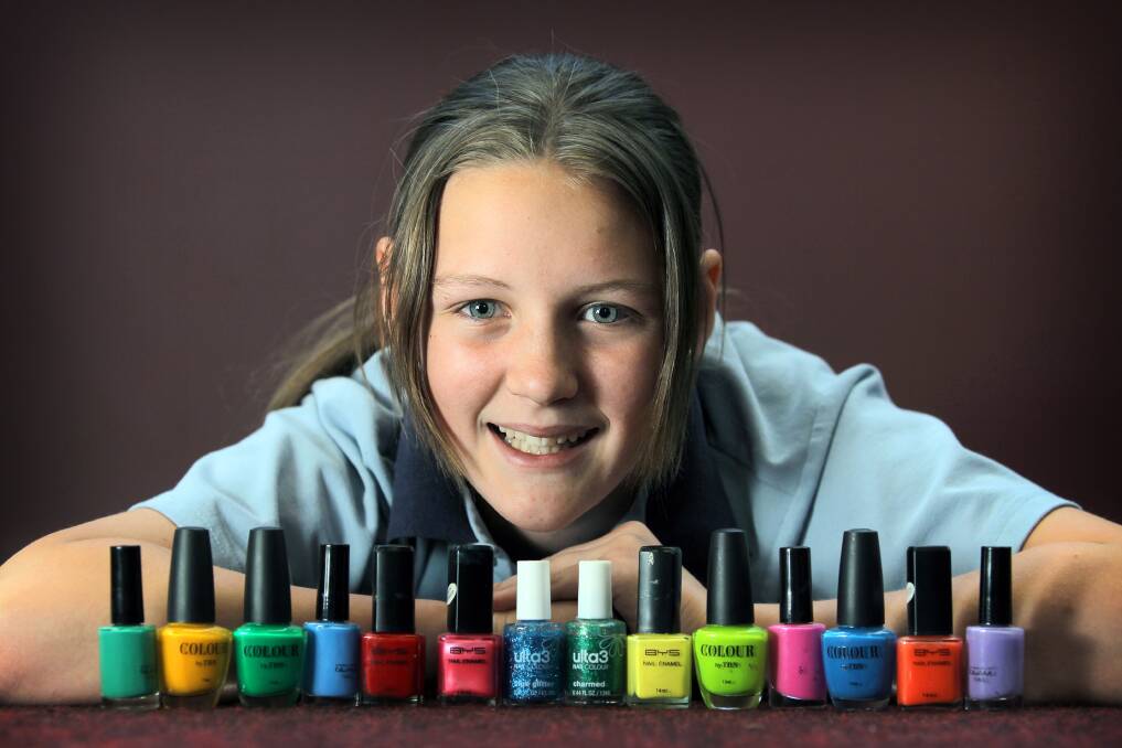Murray High School’s Nikita Lee, 12, with her nail polish bottle collection from the Coolections exhibition at the Albury Library Museum.