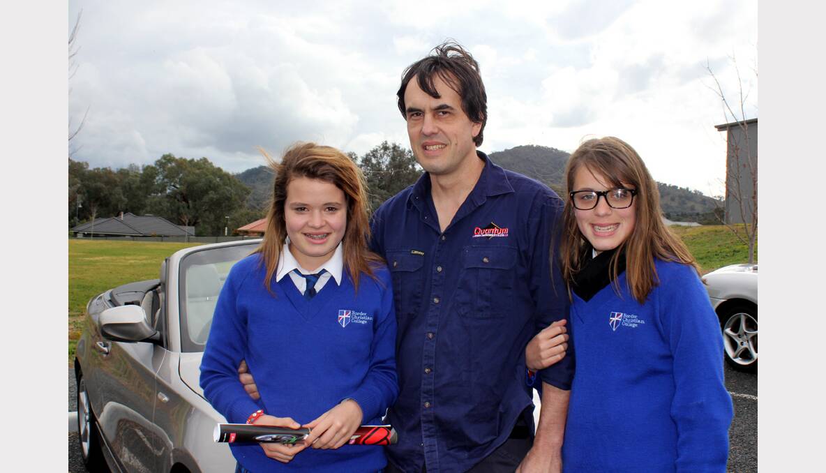 Jodie Crothers, Phil Crothers and Emily Crothers at the Border Christian College Car Show.