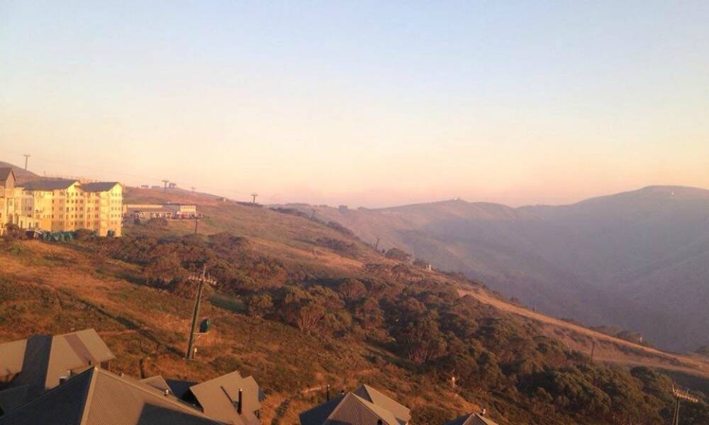Hotham Alpine Resort posted this photo on its Facebook page this morning: "Smoky start to the morning. CFA updates will be posted here. All limbs are crossed for a safer day than is forecast, for our friends in Hotham, Falls and Harrietville."