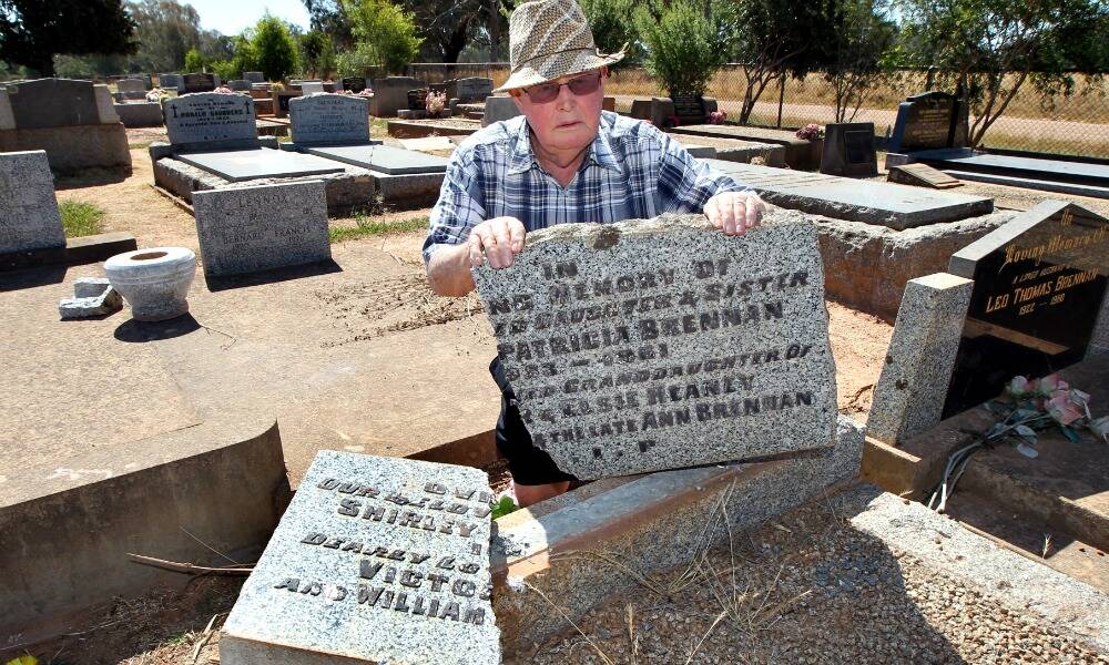 Benalla Cemetery Trust chairman Ray O’Shannessy is shocked by the extent of the vandalism. Pictures: PETER MERKESTEYN