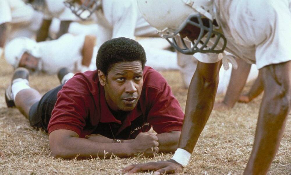 Denzel Washington stars as coach Boone in Remember The Titans.