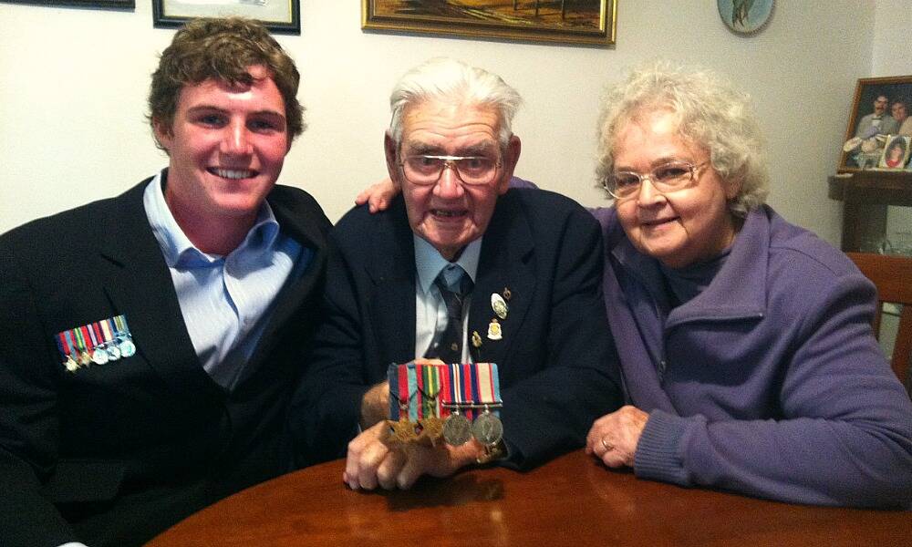 Border student Charlie Starr,16, helped reunite Maurice Dore, 90, with his medals. Pictured with wife Pam.