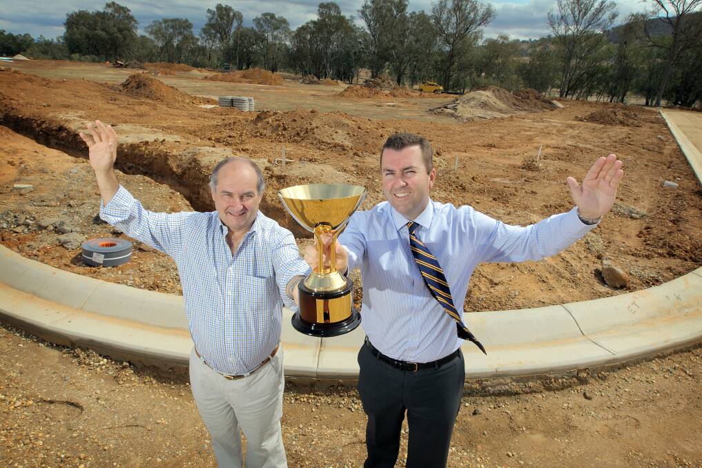 Richard Altson, director of BMA Property, which is partnering Hudson Conway, and chief executive of Albury Racing Club John Miller in front of the land Hudson Conway is giving away. Picture: TARA GOONAN