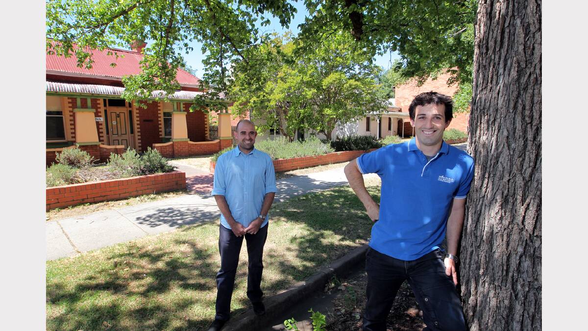 Pedro and David Afonso in front of the Charles Sturt University buildings in Wilson Street that could be demolished to make way for terraces. PICTURE: David Thorpe.