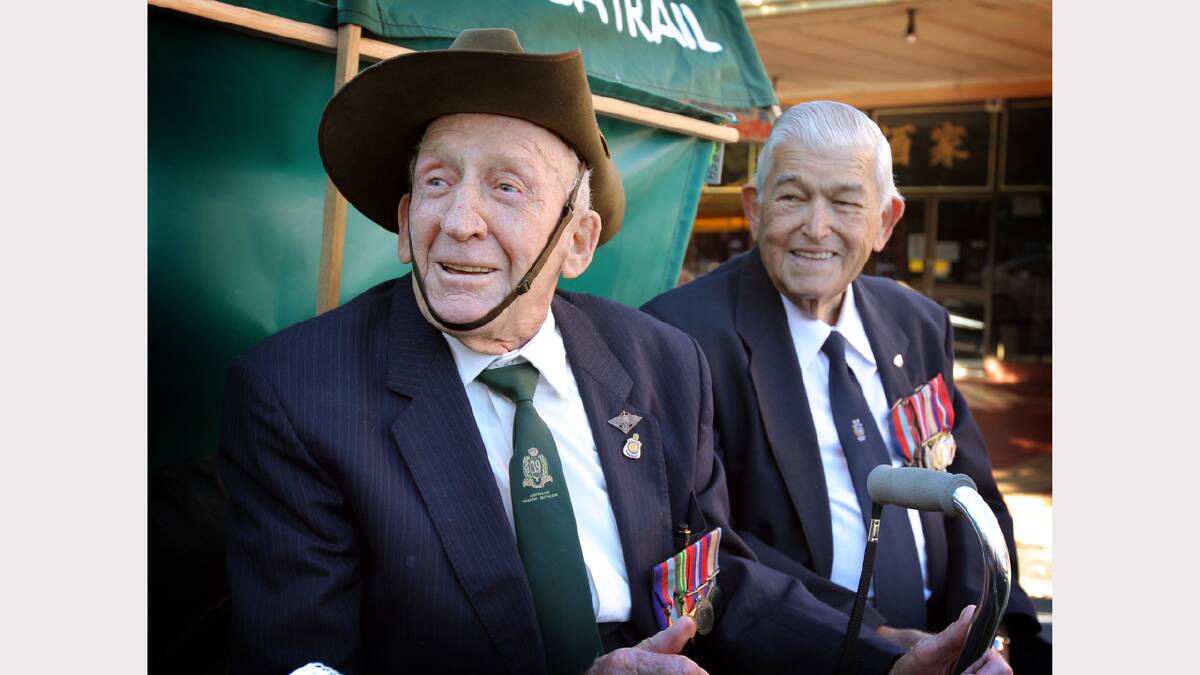 Wally Moras with Jack Sheridan in 2011 ANZAC Day march down Dean Street.