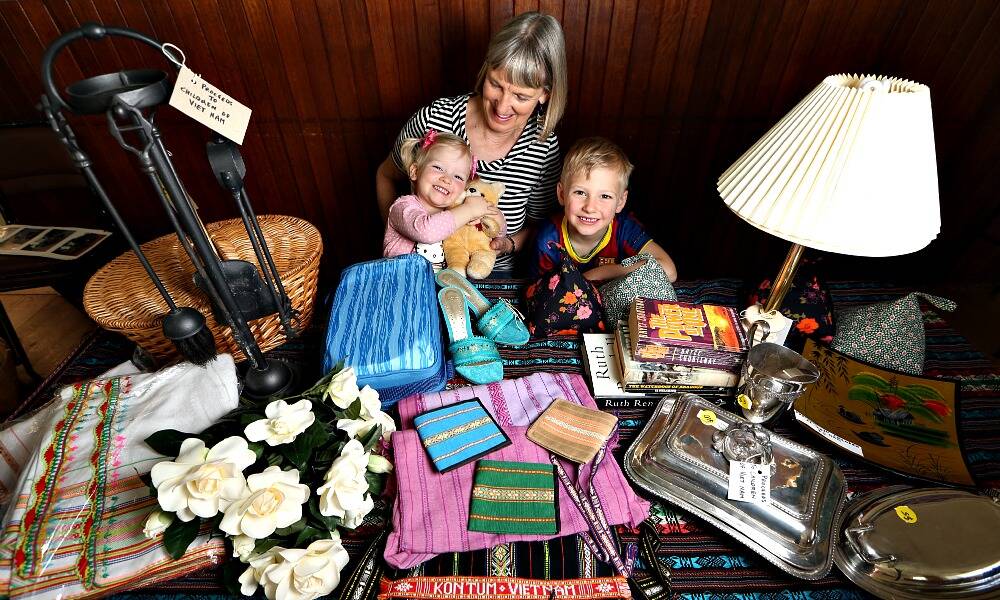 Marg Rapsey, with grandchildren Ruby, 2, and Lachlan Lewicki, 4, is raising money for Vietnam orphans. Picture: KYLIE ESLER