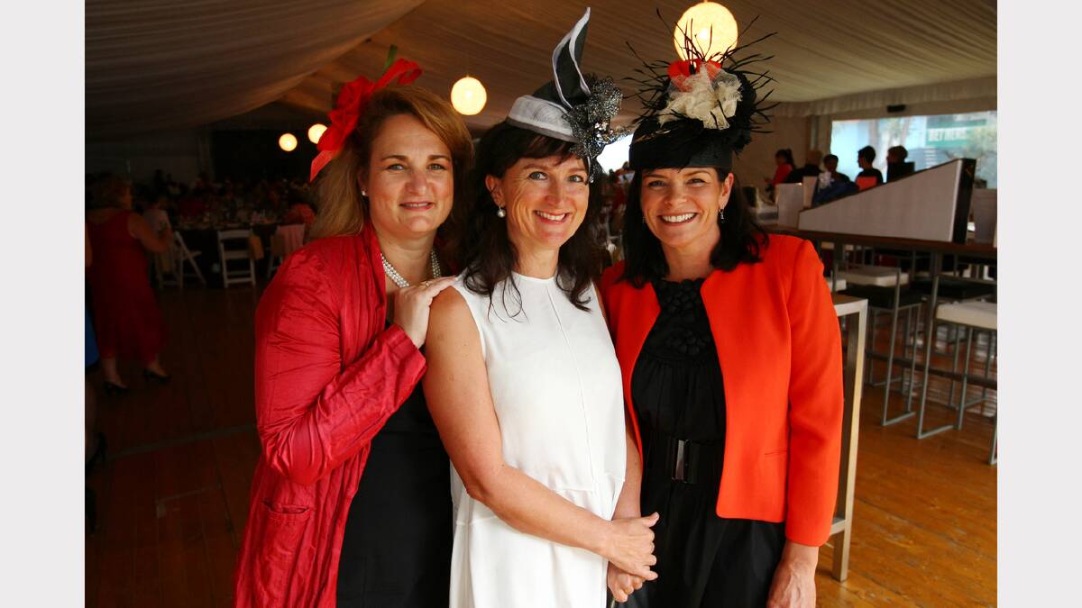 Michelle Howard, Marisa Barbic, and Bec McKenzie, of Albury, attend the Wewak St School fundraiser at the Albury Gold Cup Carnival.