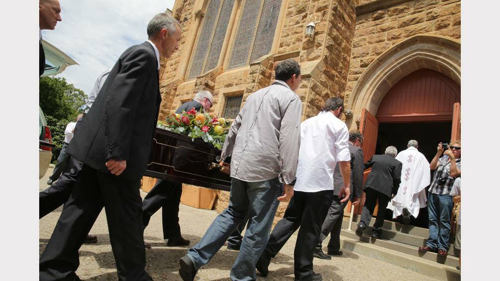 Ned Kelly's coffin is carried into St Patrick's Catholic Church. PICTURE: Leigh Henningham.