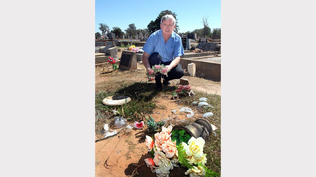 Secretary of the board of Trust, Benalla Cemetery, Jeff Knight with some of the ornaments that were on graves that had been smashed.