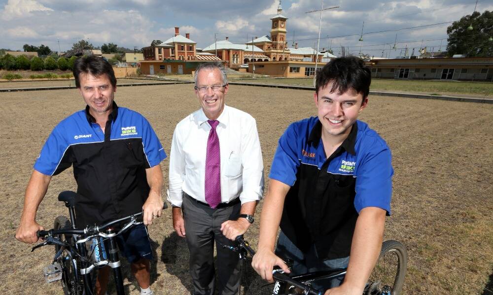 Baker Motors’ Stuart Baker, centre, celebrates securing the former Winsor Park bowling club with Pushys Bike Warehouse partners Terry and Jacob Wolki. Picture: KYLIE ESLER