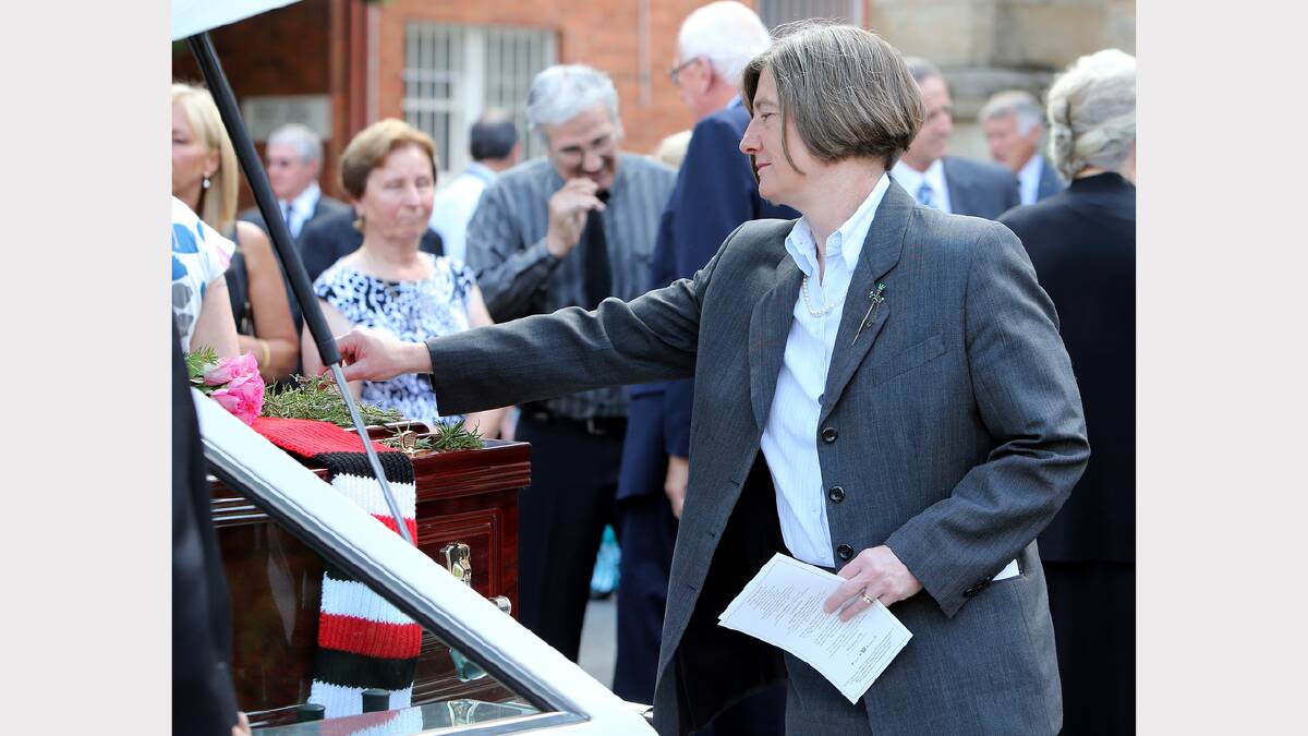 Albury mayor Alice Glachan places a sprig of rosemary on the casket. PICTURES: Kylie Esler.