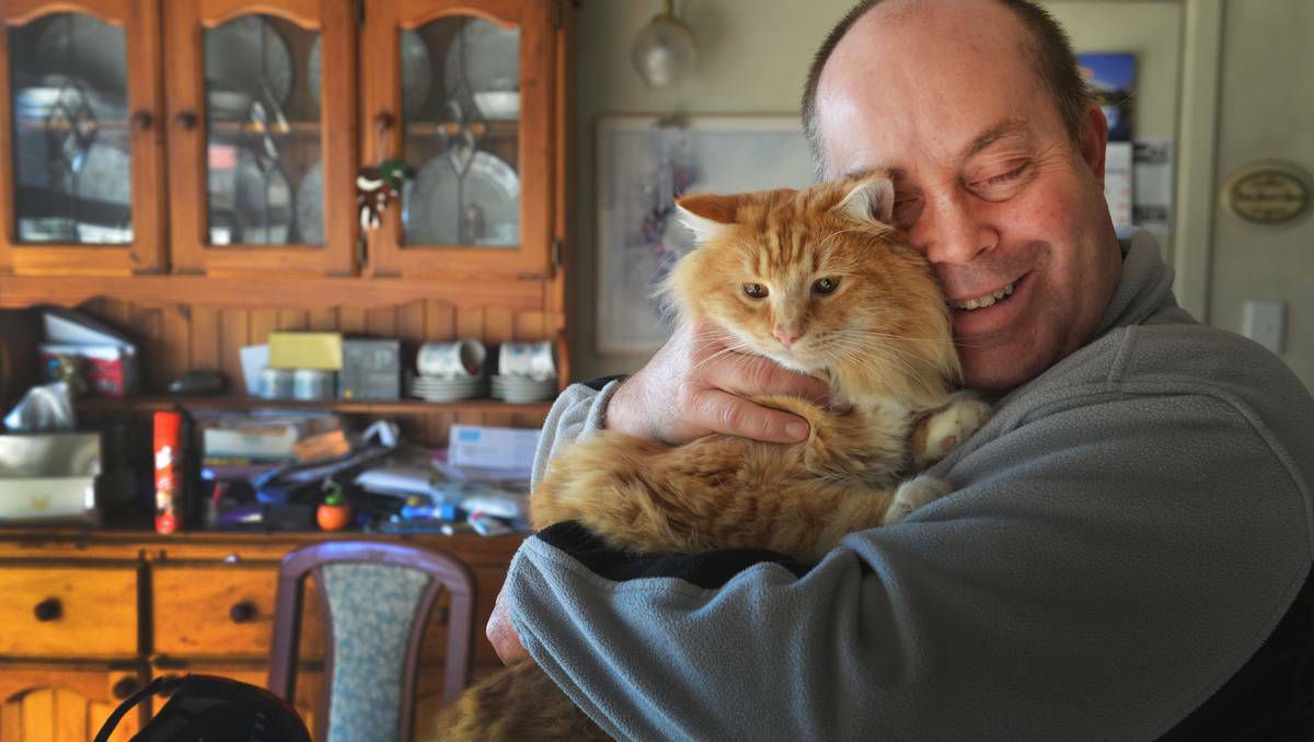 Ken Scott with rescue Garfield who saved the family from a gas leak. Picture: Bendigo Advertiser